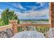 A well-appointed patio showcases comfortable seating and a beautiful view of mountains and expansive skies at 10837 Fox Sedge Way, Highlands Ranch, CO 80126