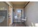 Cozy outdoor patio area perfect for relaxing with seating, small table, and plenty of sunshine at 1080 E 13Th Ave # 301, Denver, CO 80218