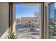 Inviting balcony view overlooking a charming street with vintage buildings and clear blue sky at 1080 E 13Th Ave # 301, Denver, CO 80218