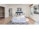 Well-lit bedroom featuring hardwood floors, a decorative rug, and neutral decor at 1080 E 13Th Ave # 301, Denver, CO 80218