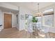 Bright dining area featuring glass table, modern chairs, and a door leading to a deck at 1080 E 13Th Ave # 301, Denver, CO 80218