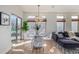 Sunlit dining area with glass table, modern chairs, and large windows offering pleasant views at 1080 E 13Th Ave # 301, Denver, CO 80218