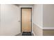 Inviting entrance to unit #301 with a welcome mat and well-lit hallway at 1080 E 13Th Ave # 301, Denver, CO 80218