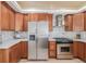 Spacious kitchen features stainless steel refrigerator and matching appliances, plus ample cabinet space at 1080 E 13Th Ave # 301, Denver, CO 80218
