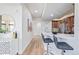 Stylish kitchen with breakfast bar, updated appliances, modern stools, and plenty of light at 1080 E 13Th Ave # 301, Denver, CO 80218