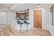Modern kitchen featuring a breakfast bar with seating, updated appliances, and hardwood floors at 1080 E 13Th Ave # 301, Denver, CO 80218