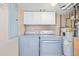 Convenient laundry room featuring a modern washer, dryer, water heater, and ample storage space at 1080 E 13Th Ave # 301, Denver, CO 80218