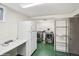 Basement laundry area with updated washer and dryer machines at 7079 S Tamarac Ct, Centennial, CO 80112