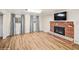 Finished basement with wood floors, fireplace, and natural light creating a cozy and inviting living space at 7079 S Tamarac Ct, Centennial, CO 80112