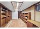 Finished basement area with custom shelving and storage at 7079 S Tamarac Ct, Centennial, CO 80112