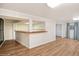 Finished basement with wood floors, bar area, and ample space for entertainment at 7079 S Tamarac Ct, Centennial, CO 80112