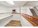 Open basement view with stairs, bar and fireplace detail at 7079 S Tamarac Ct, Centennial, CO 80112