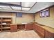 Finished basement office space with built-in desk and storage at 7079 S Tamarac Ct, Centennial, CO 80112