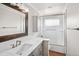 Clean and bright bathroom with marble countertop, modern fixtures, and tiled shower at 7079 S Tamarac Ct, Centennial, CO 80112