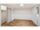 Finished basement bedroom featuring wood floors, closet, and a window offering a comfortable and private space at 7079 S Tamarac Ct, Centennial, CO 80112