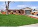 Charming single-story home featuring a well-manicured lawn and inviting curb appeal at 7079 S Tamarac Ct, Centennial, CO 80112