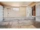 Clean, open two-car garage interior with entry door at 7079 S Tamarac Ct, Centennial, CO 80112