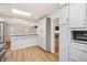 Bright kitchen with modern appliances, ample storage, and seamless access to the dining and living areas at 7079 S Tamarac Ct, Centennial, CO 80112