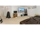 Basement rec room with a large wall-mounted TV and seating area, creating a cozy entertainment space at 1730 Ward Cir, Franktown, CO 80116
