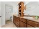 Bathroom with a dual sink vanity, granite countertops, and traditional fixtures at 1730 Ward Cir, Franktown, CO 80116