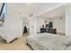 Bedroom with a gray bed, a wall mounted TV, and access to multiple rooms at 1730 Ward Cir, Franktown, CO 80116