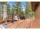 Outdoor deck with a fire pit and outdoor furniture, perfect for relaxation at 1730 Ward Cir, Franktown, CO 80116