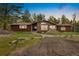 Charming single-story house with stone accents, inviting front porch, and beautifully landscaped yard at 1730 Ward Cir, Franktown, CO 80116