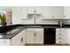 Bright kitchen featuring white cabinets, black countertops and stainless steel appliances at 1730 Ward Cir, Franktown, CO 80116