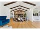 Stylish living room with vaulted ceiling, stone fireplace, and hardwood floors at 1730 Ward Cir, Franktown, CO 80116