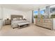 Serene main bedroom featuring a large bed, natural light, and stylish furnishings at 1730 Ward Cir, Franktown, CO 80116