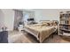 Inviting bedroom with a comfortable bed, neutral decor, and a window for natural light at 3855 S Monaco St # 209, Denver, CO 80237