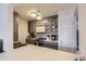 Stylish kitchen with stainless steel appliances, gray cabinetry, and a marble countertop at 3855 S Monaco St # 209, Denver, CO 80237