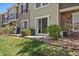 Private backyard patio area perfect for outdoor dining and relaxing, with mature landscaping at 9800 Mayfair St # E, Englewood, CO 80112