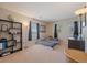 Cozy bedroom with a large window, built-in shelves, and a comfortable bed at 9800 Mayfair St # E, Englewood, CO 80112