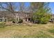 Charming townhome with stone accents, mature trees, and a well-manicured lawn at 9800 Mayfair St # E, Englewood, CO 80112