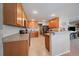 Bright kitchen featuring wooden cabinetry and modern appliances at 9800 Mayfair St # E, Englewood, CO 80112