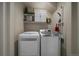 Functional laundry room with white washer and dryer at 9800 Mayfair St # E, Englewood, CO 80112