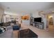 Open-concept living area with neutral tones and a staircase leading to the upper level at 9800 Mayfair St # E, Englewood, CO 80112