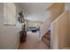 Bright entryway leading into a cozy living area with neutral tones and carpeted floors at 9800 Mayfair St # E, Englewood, CO 80112