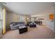Spacious living room featuring neutral colors, a large window, and comfortable seating at 9800 Mayfair St # E, Englewood, CO 80112