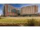 UC Health Hospital campus with modern brick buildings, surrounded by well-maintained lawns and landscaping at 2868 Kingston St, Denver, CO 80238
