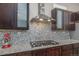 Kitchen boasts granite counters, decorative backsplash, stainless steel appliances, and ample cabinet space at 2868 Kingston St, Denver, CO 80238