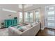 Bright living room with comfortable seating, large windows, and a stylish cabinet at 2868 Kingston St, Denver, CO 80238