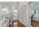 Bright living room with a view into the office space, and a view to the outside at 2868 Kingston St, Denver, CO 80238