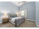 Serene main bedroom with vaulted ceiling, neutral tones, plush carpet, and lots of natural light at 2868 Kingston St, Denver, CO 80238