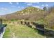 Landscaped backyard with tiered retaining walls and beautiful natural scenery at 53 Taylor Ct, Castle Rock, CO 80104