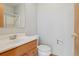 A clean bathroom features a vanity sink, toilet, and shower with glass doors at 53 Taylor Ct, Castle Rock, CO 80104