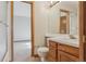 Bathroom with wood cabinets, toilet and a shower with glass door, a glimpse of bedroom at 53 Taylor Ct, Castle Rock, CO 80104