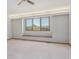 Bright bedroom featuring carpet floors, light walls and a window seat overlooking scenery at 53 Taylor Ct, Castle Rock, CO 80104