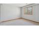 A neutral bedroom with a window provides a calm and relaxing space at 53 Taylor Ct, Castle Rock, CO 80104